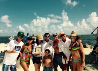 #Events: Golf balls + Water + 90 hours = fish food - A group of people standing on a beach posing for the camera - Water