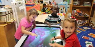 #News: Equal opportunity for children - A little boy sitting at a table using a laptop - Kindergarten