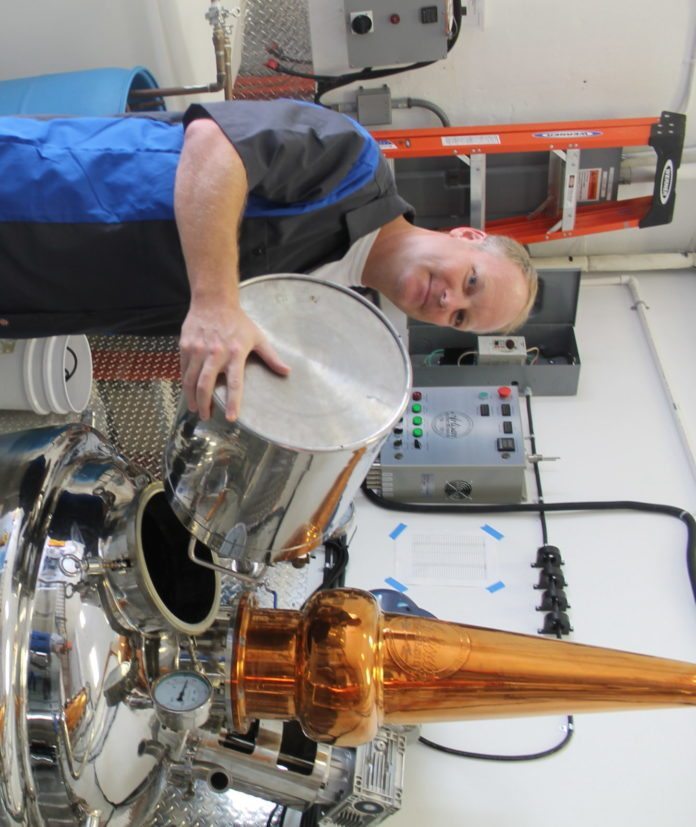 #Feature: Locals making liquor - A person on the machine - Engineering