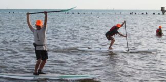 #Events: Special Olympics changes lives - A group of people riding skis on a body of water - Surfing