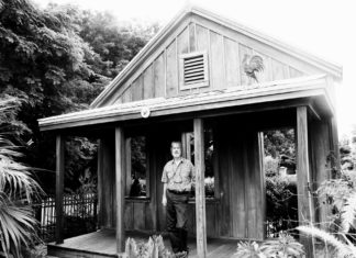 #Column: History of Key West is told by a string of markers - A person standing in front of a building - House