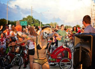 #Events: Zombie Bike Ride happens Sunday - A group of people riding on the back of a bicycle - Bicycle