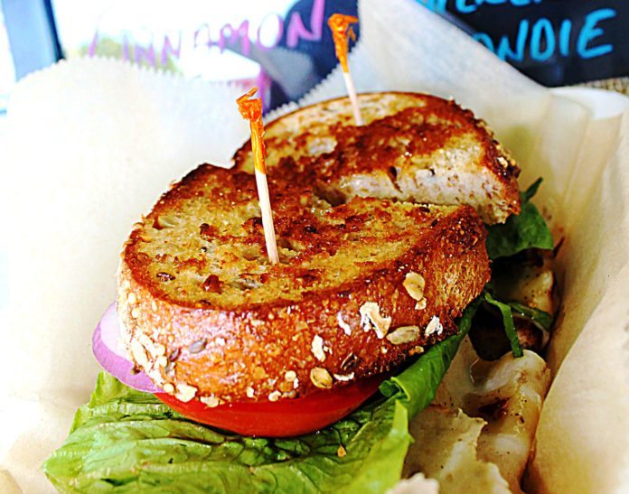 #Eat: New to-go spot has mouthwatering BBQ - A close up of a sandwich on a plate - Hamburger