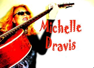 #Events: Michelle Dravis can play every style - A person holding a guitar - Bass guitar