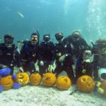 #Events: Divers Carve Pumpkins Underwater in Keys Marine Sanctuary - A group of people are underwater - Scuba diving