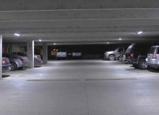 #News: City nixes parking garage study - A car parked in a parking lot - Light