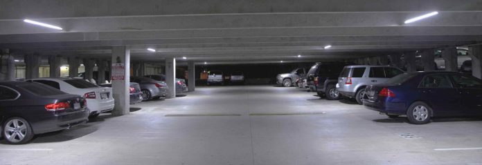 #News: City nixes parking garage study - A car parked in a parking lot - Light