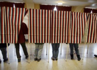 #Elections: Referendum explanations - A group of people standing in a room - Voting