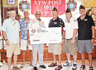 #Events: Veterans Day celebrated in Key West - A group of people posing for a photo - T-shirt