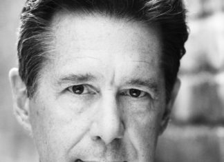 #See: Theatre season begins - Bob Bowersox wearing a suit and tie smiling and looking at the camera - Bob Bowersox