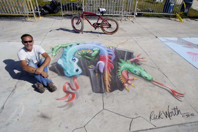 #Events: Key West Chalk Festival - A person sitting on a bench - Street art