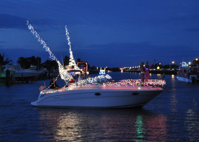 #Events: Boat Parades to brighten holidays in the Florida Keys - A small boat in a body of water - Yacht