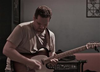 #Music: Rick Fusco follows his heart - A man holding a guitar - Bass guitar