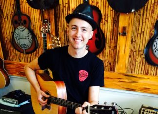 #Music: Maksim Medved plays with passion #Music: Maksim Medved plays with passion - A man holding a guitar - Acoustic guitar