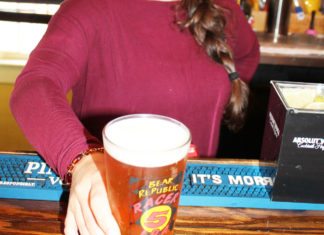 #Libation: Shots and Giggles - A person sitting at a table with a cup of coffee - Instant coffee