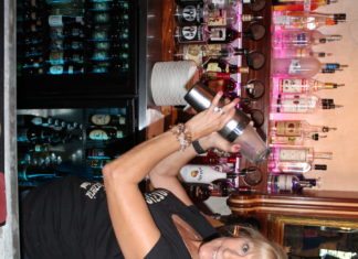 #Libation: Bartender Debbie Peacock mixes a jalapeño watermelon mojito - A person standing in front of a store - Alcoholic Beverages