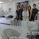 #Shop: Salon lavishes luxury on patrons - A group of people standing in front of a mirror posing for the camera - Beauty Parlour