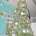 #Events: A slightly tipsy tree for a good cause - A group of stuffed animals sitting next to a christmas tree - Christmas tree
