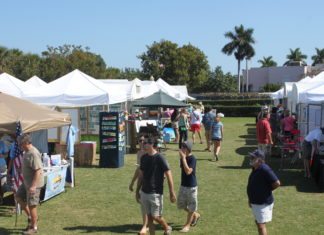 Pigeon Key Art Festival is this weekend - A group of people in a tent - Pigeon Key