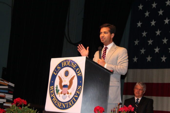 Congressmen shares platform and experience with Weekly - Carlos Curbelo holding a book - Homosassa Springs