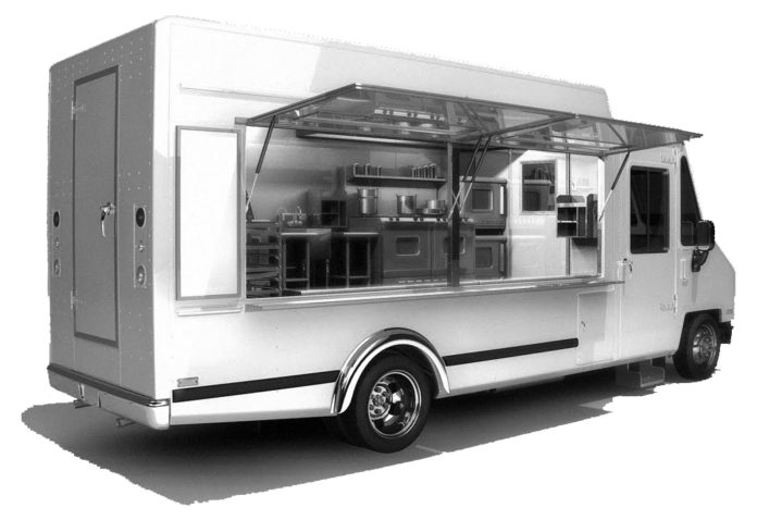 Planning considers food truck law - A white and black truck sitting on the side of a building - Food truck