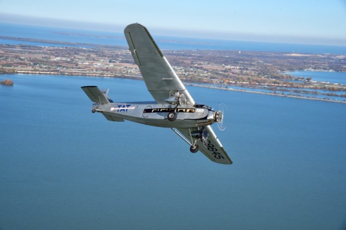Country’s first airliner visiting Marathon - A plane flying over a body of water - Ford Trimotor