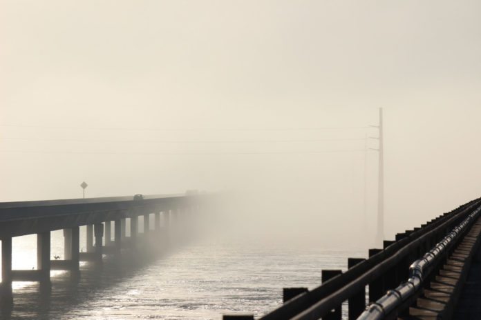 Rare fog envelops Keys, lasts two days - A long bridge over a body of water - Fog