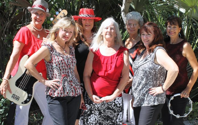 Gearl Jam plays in Big Pine Key this weekend - A group of people posing for the camera - Music