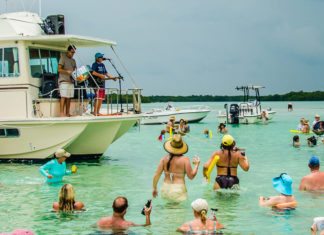 Island Grass Music Fest benefits Habitat - A group of people on a boat in the water - Snipe Point