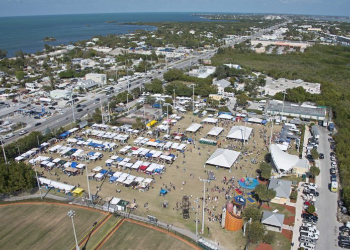 Giving back – Seafood Festival funds many programs - A group of people on a beach - Bird's-eye view