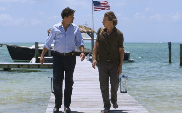 Netflix series filmed in the Upper Keys debuts - A man standing next to a body of water - Kyle Chandler