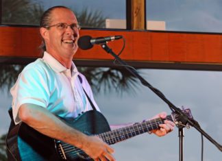 Bil Krauss takes comedy and music seriously Bil Krauss takes comedy and music seriously - A man holding a guitar - Bass guitar