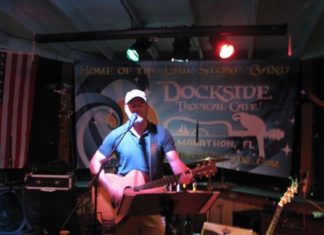 Musician Michael Hammond Island Tour Musician Michael Hammond Island Tour - A person standing in front of a stage - Musician