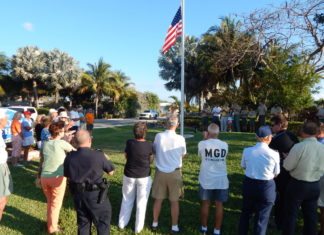 Scout responsible for new flagpole – Ben Ryder organizes project at entrance to Key Colony Beach - A group of people standing in the grass - Tree