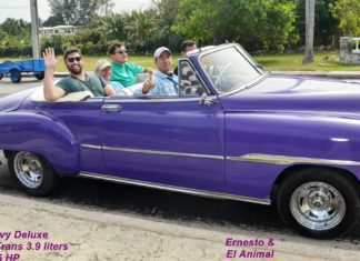 All things Cuba – The Weekly visits the Island ‘A Million Miles Away’ - A boy in a blue car parked in a parking lot - Car