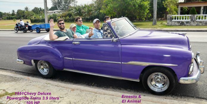 All things Cuba – The Weekly visits the Island ‘A Million Miles Away’ - A boy in a blue car parked in a parking lot - Car