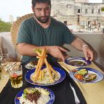 All things Cuba – The Weekly visits the Island ‘A Million Miles Away’ - A person sitting at a table with a plate of food - Breakfast