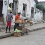 All things Cuba – The Weekly visits the Island ‘A Million Miles Away’ - A group of people on a sidewalk - Street