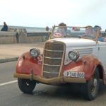 All things Cuba – The Weekly visits the Island ‘A Million Miles Away’ - A red truck parked on the side of a road - Antique car