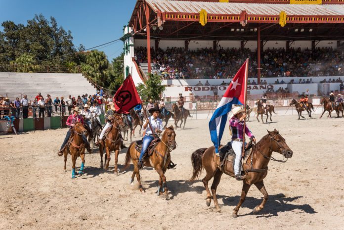 A Gringo’s peek at a Cuban Rodeo - A group of people riding horses on a beach - Rodeo