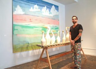 Clay artist endeavors to sculpt lasting work - A man standing in a room - Art