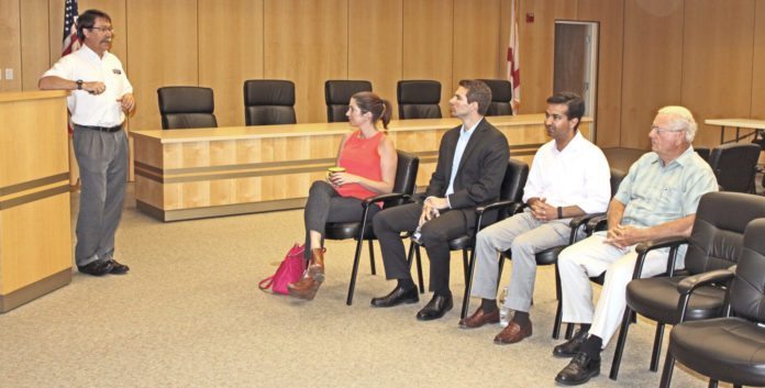 Curbelo pays 2-day visit to the Keys - Carlos Curbelo et al. sitting in a chair - Public Relations