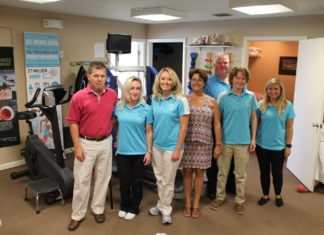 Body Owners features leading-edge equipment - A group of people standing in a room - Body Owners Physical Therapy