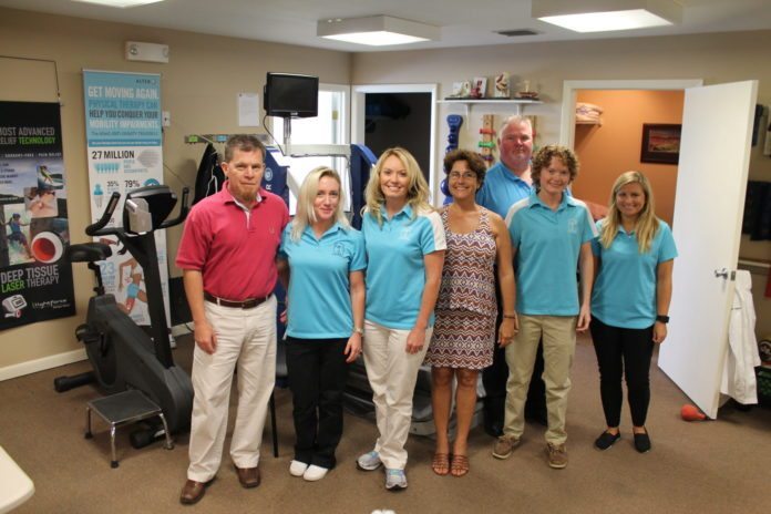 Body Owners features leading-edge equipment - A group of people standing in a room - Body Owners Physical Therapy