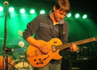 Bay Jam 21 grooves on Sunday – Day of music set for the Upper Keys - A man holding a guitar - Bass guitar