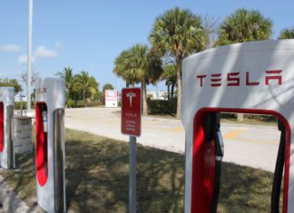 Electric car charging stations installed in the Keys - A sign on the side of the road - Car