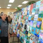 Mosaic project on display – Key West is final stop on art tour - A group of people standing in a room - Art