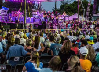 Grand Funk Railroad plays Key West on May 2 - A group of people on a stage in front of a crowd - Joe Cleghorn Homes
