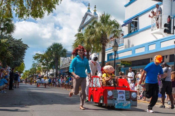 Conch Republic rides again! Annual celebration starts on Friday - A group of people walking down the street - Car