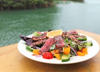 Hidden restaurant with noticeable flavor - A plate of food on a table - Geiger Key Marina